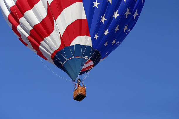 Red hot air balloon against white background with copy space, full frame horizontal composition