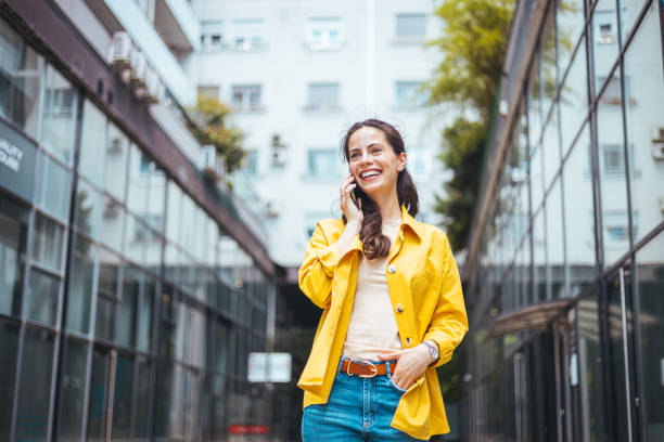 istock Woman talking on phone outdoor. 1571692215