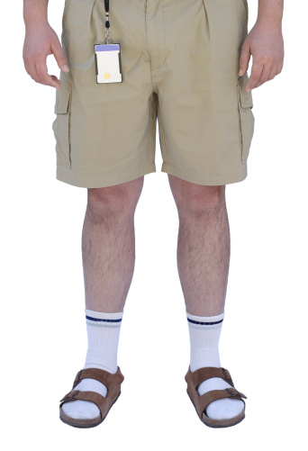 A typical picture of an engineer in shorts, tennis socks and sandals. Put your own picture on the badge. Photo isolated on white.