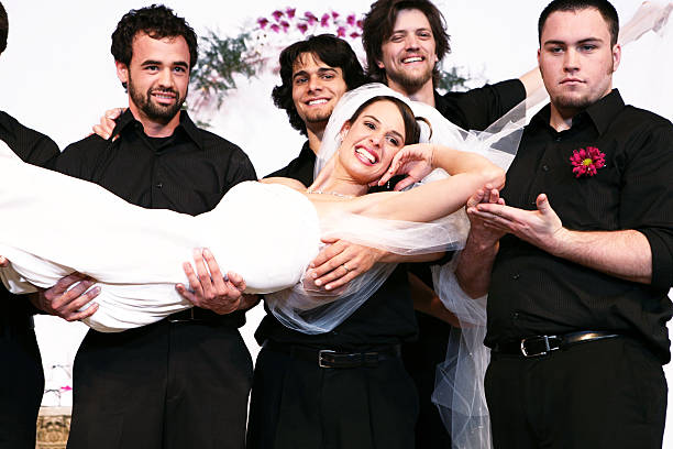 istock Groomsmen Carrying Bride Portrait 157169458