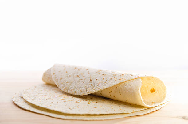 istock Pita bread on kitchen wooden plank 157169909