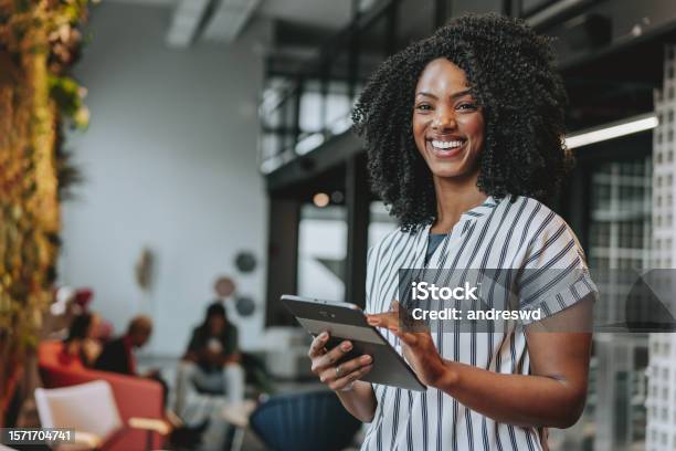 Business Woman Holding Digital Tablet Smiling Stock Photo - Download Image Now - Women, Entrepreneur, Office