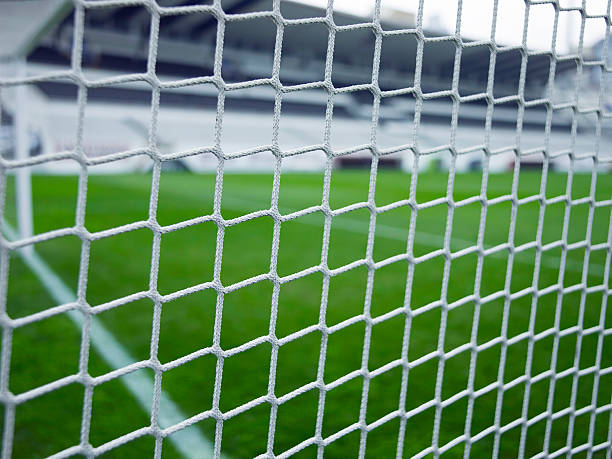 istock Soccer goal net and the stadium 157171483