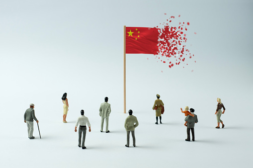 Chinese flag disintegrating (the concept of economic crisis, pandemic, internal opposition, terrorism, refugees, etc.)