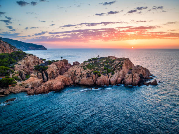 istock sun rising in costa brava coast, Aigua Xelida, Cap de Begur, Spain 1571750208