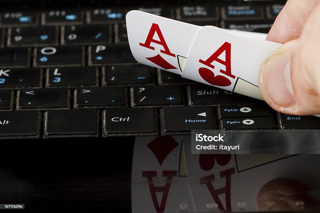 Two aces Two aces on a computer keyboard with a reflection. Ace Stock Photo