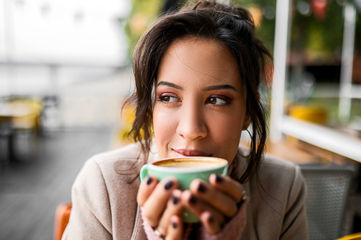 Restaurant customer relaxing drinking coffee smelling aroma