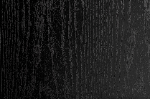 Close up background of black stained wood.
