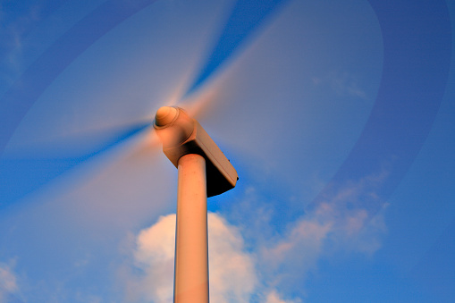 Close-up wind turbines stock photo.