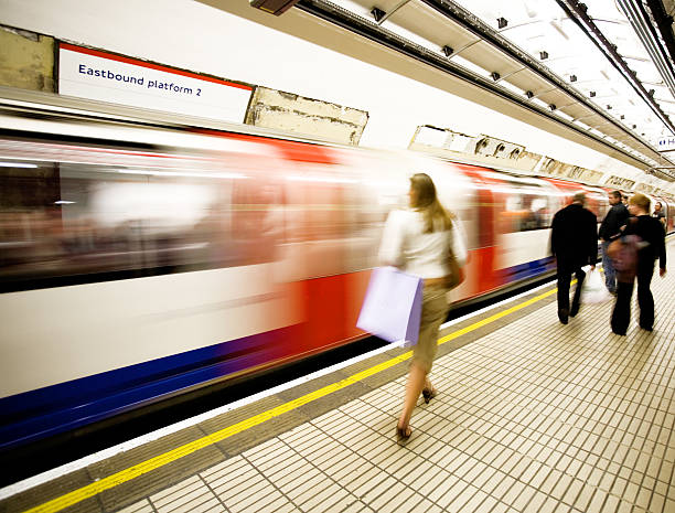 Catching the tube Commuting to work london england rush hour underground train stock pictures, royalty-free photos & images