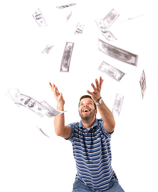 istock Young Adult Catching Money 157180105