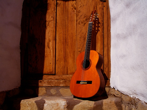 Acoustic guitar in spanish setting with warm tones perfect for album cover, Guitar made in Spain