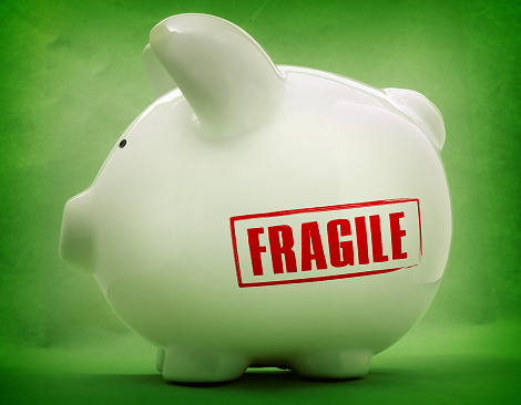 a piggy bank with the FRAGILE lettering imprinted