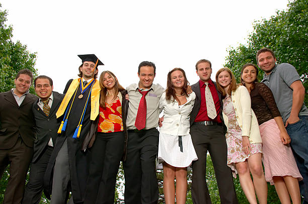 College graduate and friends celebrating stock photo