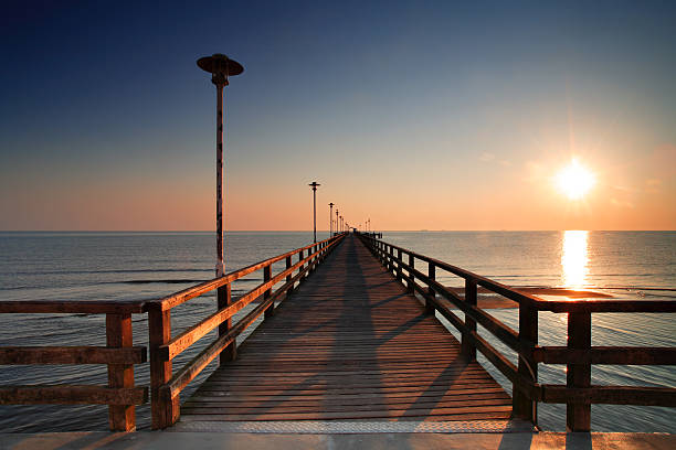 istock Long Wooden Dock and Ocean at Sunrise 157180825
