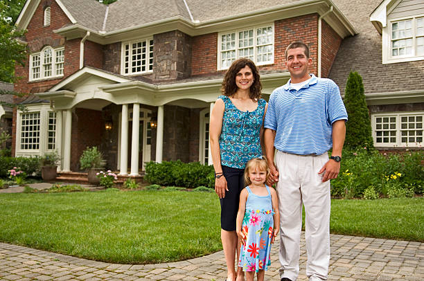 istock Young Family In Front of Home 157180910