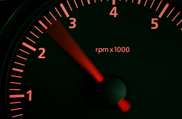 Rising Revs on Car Dashboard Car rev counter needle displays a rising engine speed.  Backlit display and needle. Revving stock pictures, royalty-free photos & images