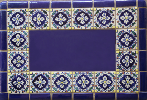 Typical Portuguese decorations with blue colored ceramic tiles. Traditional azulejo - vintage ceramic background.