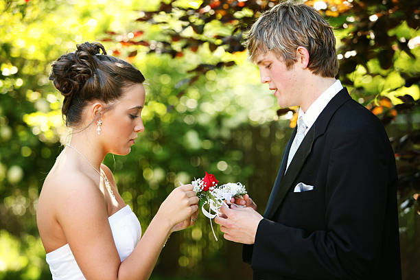 istock Young Couple Exchanging Flowers for Prom 157181325