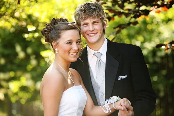 Young Couple Posing for Prom Photos  prom photos stock pictures, royalty-free photos & images