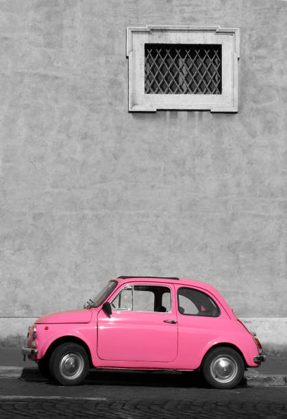 istock Tiny pink vintage car, Rome Italy 157181480