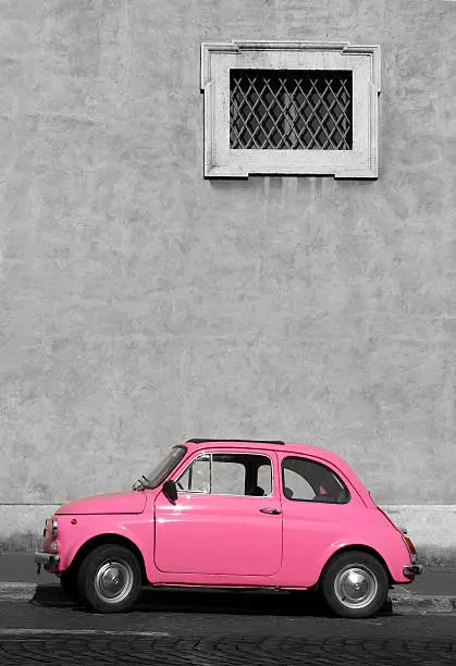 Photo of Tiny pink vintage car, Rome Italy