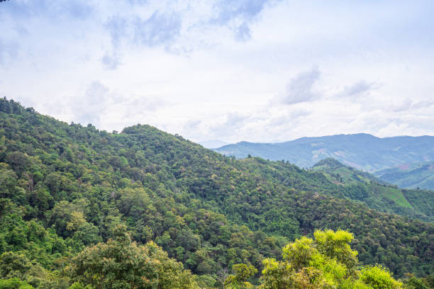 istock Scenic view of mountains against cloud sky 1571815290