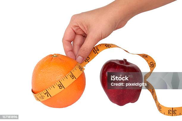 Foto de Comparando Coisas Das Mesmas Laranja Ou Perda De Peso e mais fotos de stock de Comparação