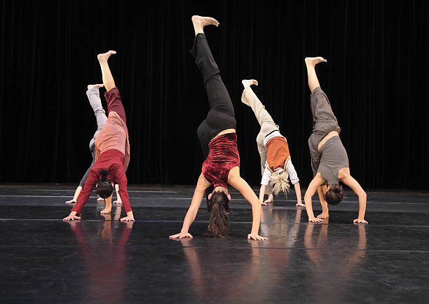istock Group of contemporary dancers performing on stage 157182036