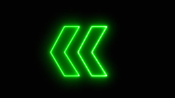 istock Bright green arrow for evacuation direction illuminated indoors. neon left direction in the night. Flashing direction indicators. 1571820550