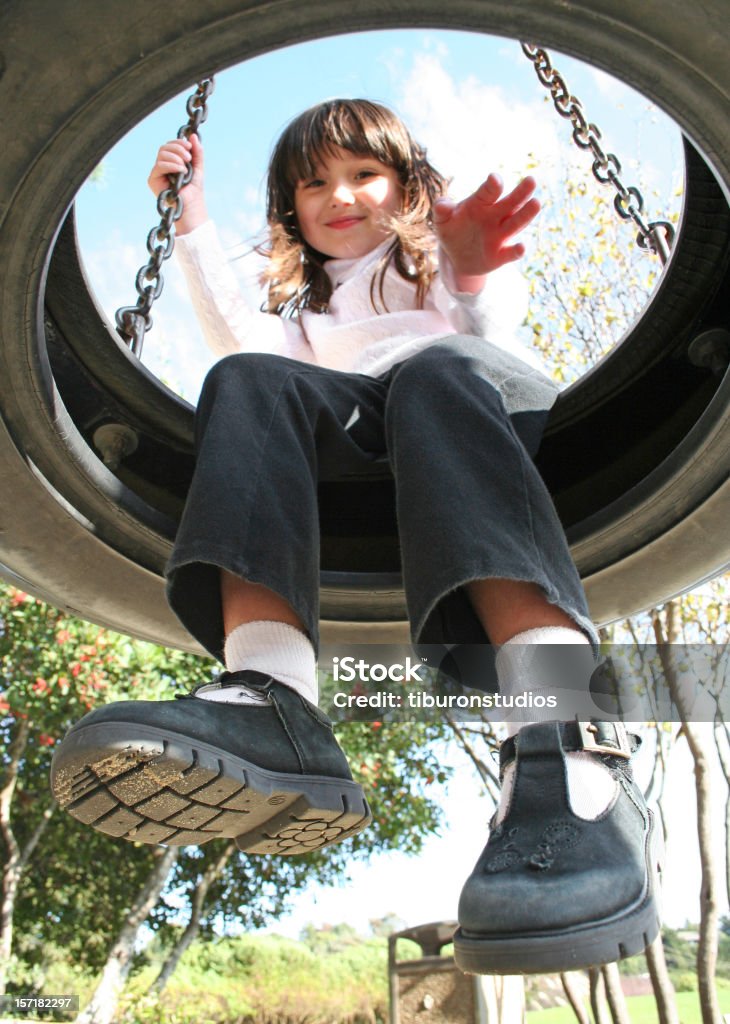 Hello, Designers! (Girl waving from tire swing)  Circle Stock Photo