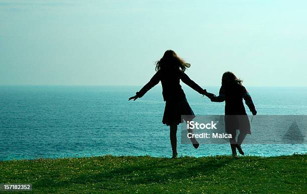 Dancing By The Sea Stock Photo - Download Image Now - 4-5 Years, 8-9 Years, At The Edge Of