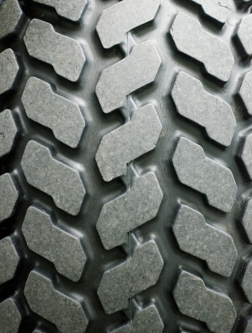 Detail of a high-grip rubber tire tread.