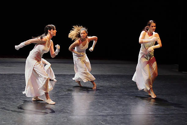 istock Group of contemporary dancers performing on stage. 157182452