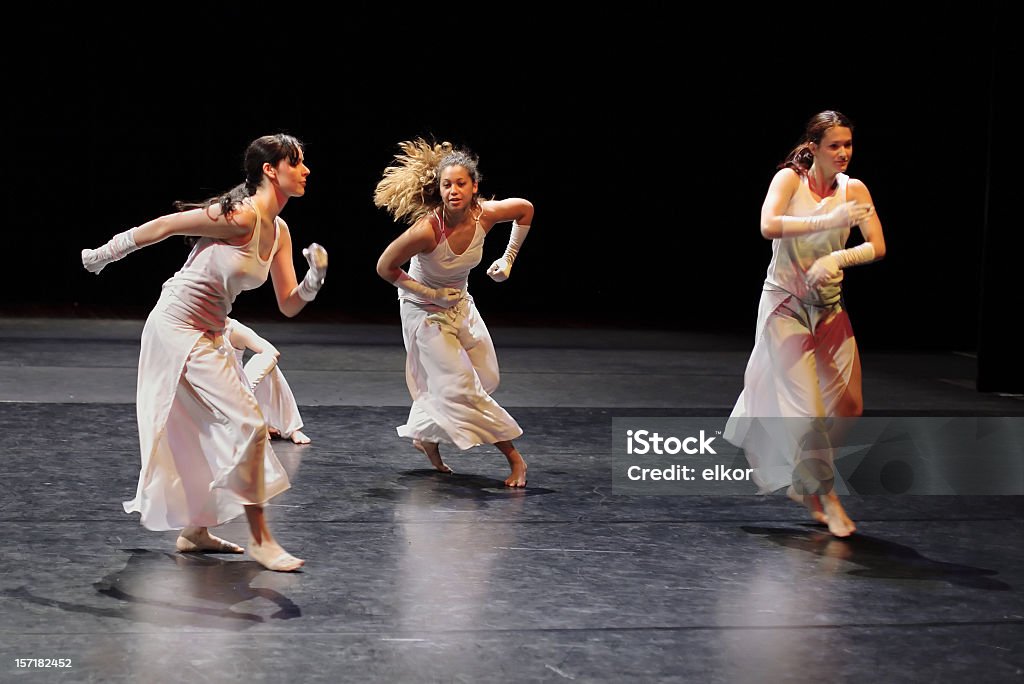 Group of contemporary dancers performing on stage. Contemporary dance. Art Stock Photo