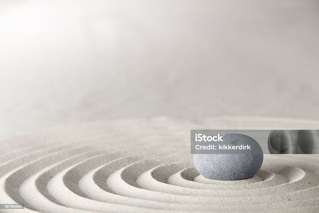 spa or zen background spa and zen background relaxation and meditation concept for purity spirituality serenity calmness peaceful harmony simplicity relax sand and stone with lines and copyspace Japanese Rock Garden Stock Photo