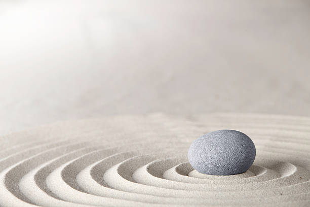 spa or zen background spa and zen background relaxation and meditation concept for purity spirituality serenity calmness peaceful harmony simplicity relax sand and stone with lines and copyspace japanese rock garden stock pictures, royalty-free photos & images