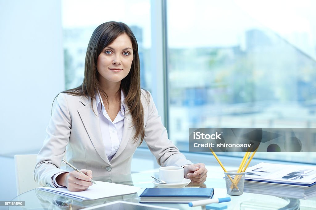 Writing proficiency test Portrait of young female writing proficiency test Adult Stock Photo