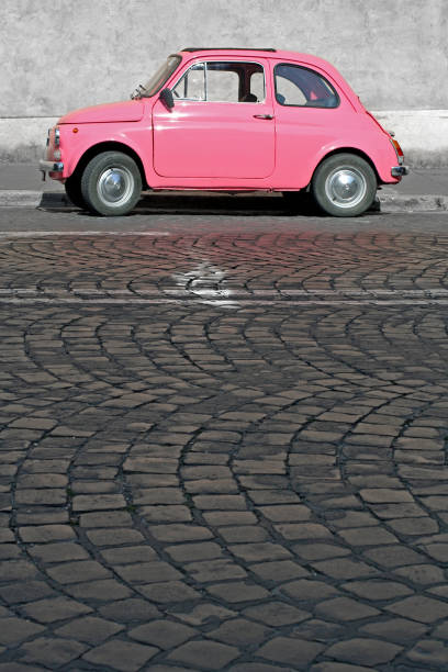 istock Tiny pink vintage car, Rome Italy 157185066