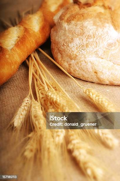 Loaved Of Bread With Stalks Of Wheat Stock Photo - Download Image Now - Baguette, Baked, Bakery