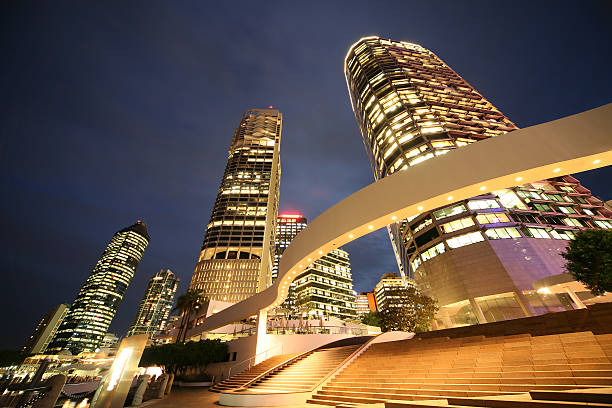 istock Angled view of large buildings lit up at night 157185164