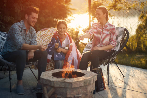 istock Family Bonding Around the Fire, Celebrating Independence Day with Marshmallows 1571851893