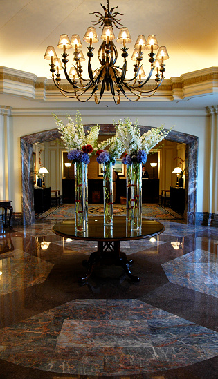 Luxurious hotel lobby with marble floors, fresh flowers and elegance galore. Need photos of hotel lobbies? Please see these...  