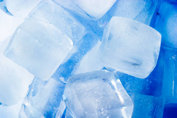 Icecubes with blue color cast to give extra cool feel stock photo