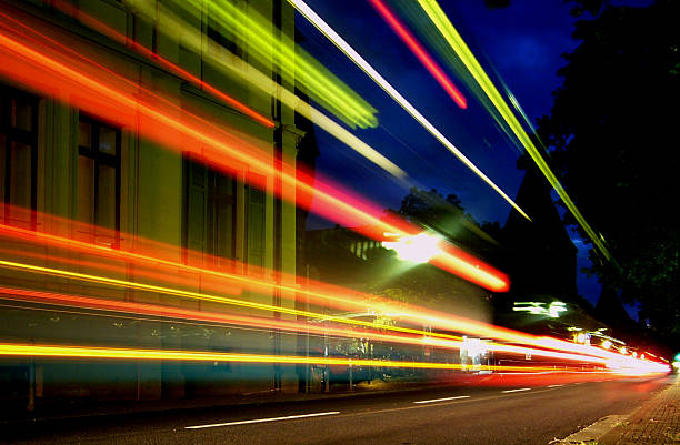 istock Lines of blurred light along road at night 157185528