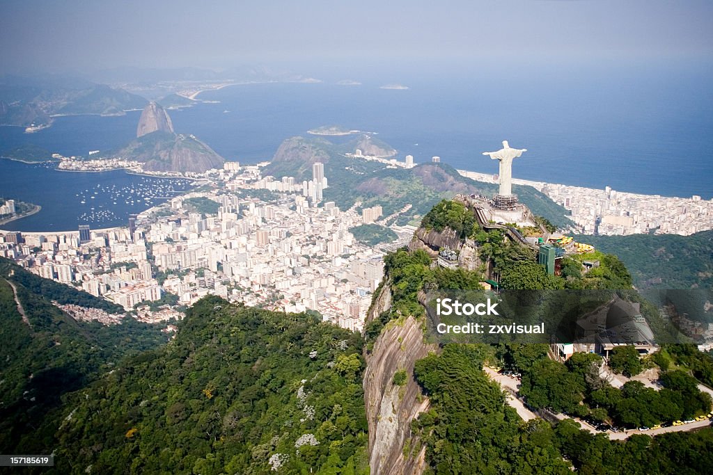Aerial of Rio de Janeiro Aerial view of Rio de Janeiro on a sunny day taken from a helicopter.  In view are the landmarks Christ the Redeemer and Sugarloaf Mountain. Rio de Janeiro Stock Photo