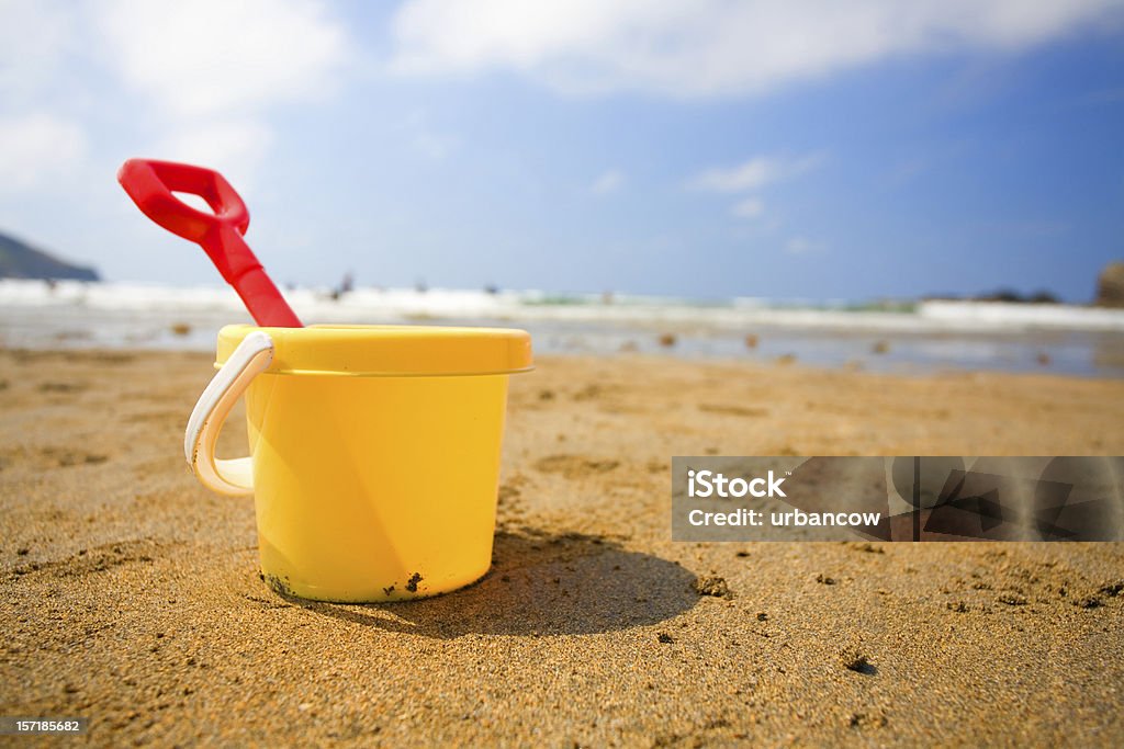 Bucket and spade A bucket and spade on a beach Beach Stock Photo