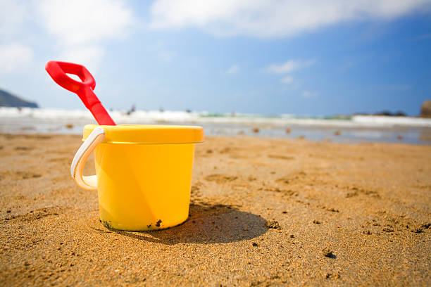 Bucket and spade A bucket and spade on a beach sand pail and shovel stock pictures, royalty-free photos & images