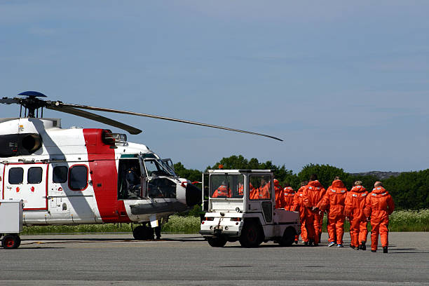 istock oil rig workers boarding an offshore helicopter 157185949
