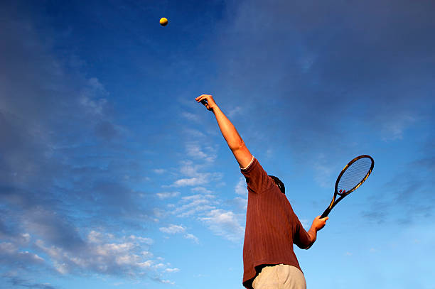 istock Adult tennis player serving 157185952